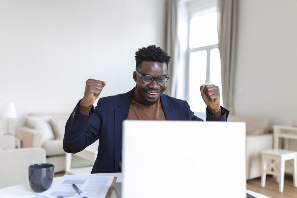 A man showing excitement as he progresses in his business.